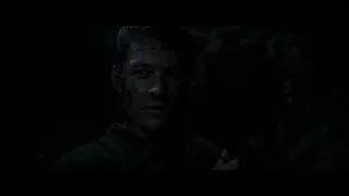 distressed man covered in blood in dark cave — Hacksaw Ridge