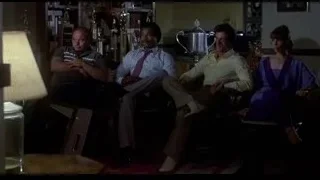 Four people in formal attire sitting in living room — Rocky III