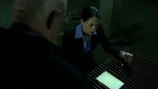 man and woman writing on paper in dark room — Breaking Bad