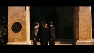 man in robe waving to crowd — Into the Wild