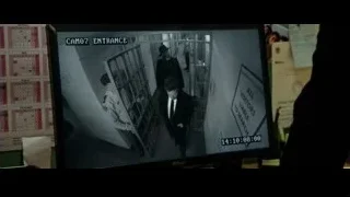 man in suit walking in hallway — Now You See Me 2