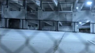 Red sports car driving in parking garage — Sports Cars