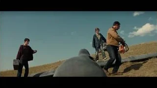 three men on large metal pipe in field — Interstellar