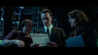 three people in dimly lit room reading newspaper — Steve Jobs